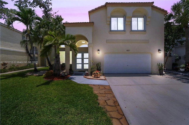 801 NW 156th Ave, Pembroke Pines, FL 33028 - mediterranean / spanish-style home featuring an attached garage, stucco siding, concrete driveway, a yard, and a tiled roof