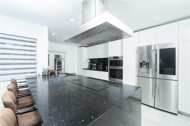 3404 Garden Ln, Miramar, FL 33023 - kitchen featuring stainless steel appliances, island range hood, white cabinets, modern cabinets, and dark stone countertops