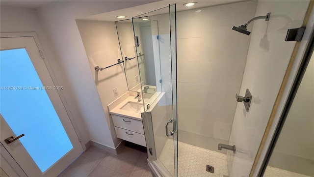 900 Bay Dr Unit 906, Miami Beach, FL 33141 - full bathroom featuring a stall shower, vanity, recessed lighting, and tile patterned flooring