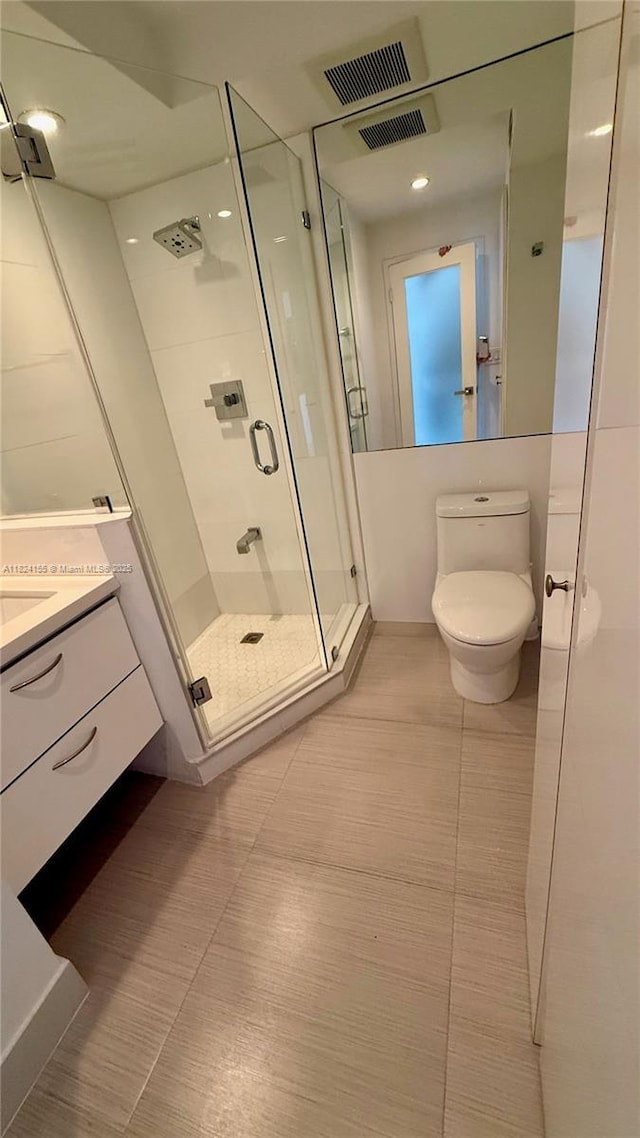 900 Bay Dr Unit 906, Miami Beach, FL 33141 - bathroom with a stall shower, vanity, and tile patterned floors