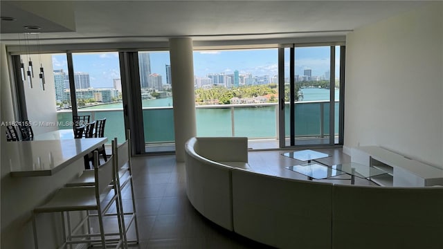 900 Bay Dr Unit 906, Miami Beach, FL 33141 - living room featuring a view of city, a water view, and tile patterned floors