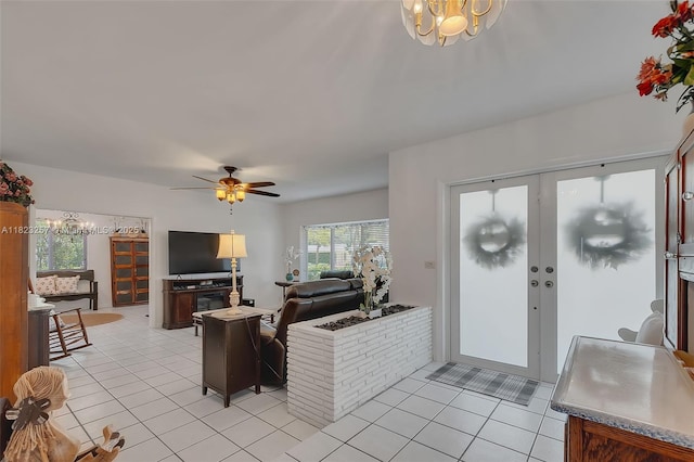 7340 SW 123rd Ter, Pinecrest, FL 33156 - living area with a chandelier, light tile patterned floors, a ceiling fan, and french doors
