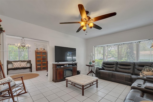 7340 SW 123rd Ter, Pinecrest, FL 33156 - living room featuring light tile patterned floors, a chandelier, and ceiling fan