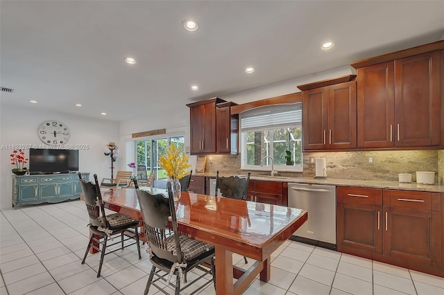 7340 SW 123rd Ter, Pinecrest, FL 33156 - kitchen featuring stainless steel dishwasher, tasteful backsplash, healthy amount of natural light, recessed lighting, and light tile patterned flooring