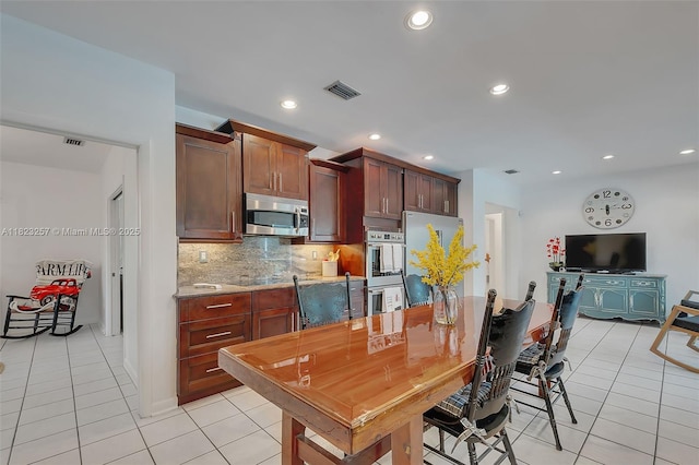 7340 SW 123rd Ter, Pinecrest, FL 33156 - kitchen with stainless steel appliances, light tile patterned flooring, backsplash, and recessed lighting