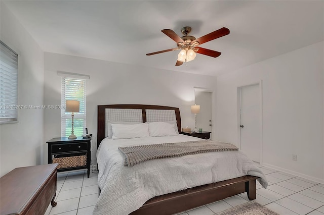 7340 SW 123rd Ter, Pinecrest, FL 33156 - bedroom with light tile patterned floors and a ceiling fan