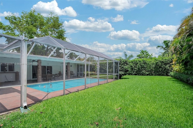 7340 SW 123rd Ter, Pinecrest, FL 33156 - swimming pool with ceiling fan, a yard, a patio, and a lanai