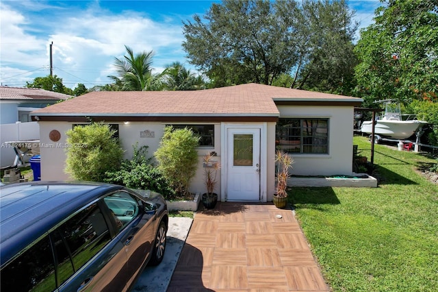 1395 NE 178th St, North Miami Beach, FL 33162 - single story home with a front yard, stucco siding, and roof with shingles