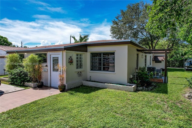 1395 NE 178th St, North Miami Beach, FL 33162 - view of front of property featuring a front lawn and stucco siding