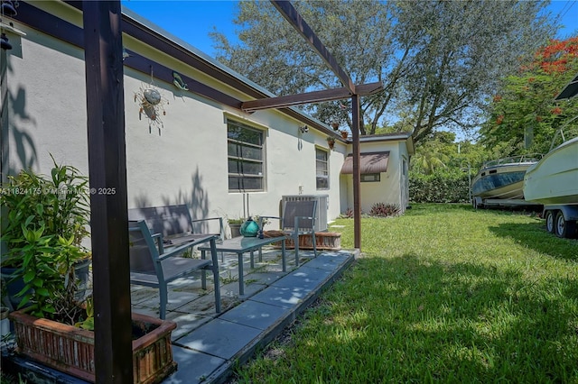 1395 NE 178th St, North Miami Beach, FL 33162 - view of green lawn featuring a patio area