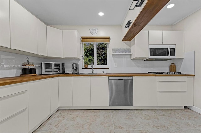 10371 SW 146th St, Miami, FL 33176 - kitchen with dishwasher, white microwave, gas stovetop, open shelves, and white cabinetry