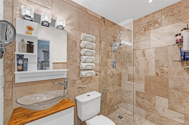 10371 SW 146th St, Miami, FL 33176 - bathroom featuring a tile shower, vanity, and tile walls