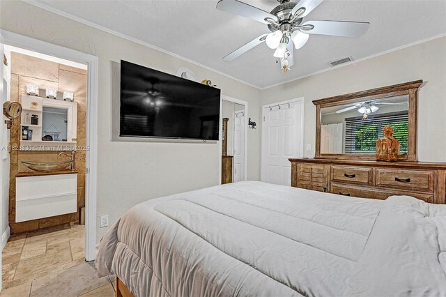 10371 SW 146th St, Miami, FL 33176 - bedroom featuring stone tile floors, crown molding, connected bathroom, and a ceiling fan