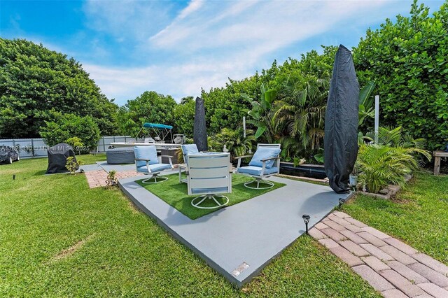 10371 SW 146th St, Miami, FL 33176 - view of community with a patio and an outdoor living space