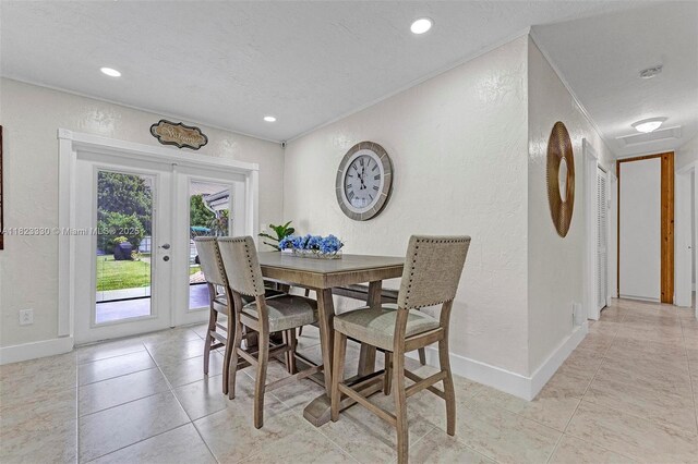 10371 SW 146th St, Miami, FL 33176 - dining room featuring a textured wall, french doors, light tile patterned floors, a textured ceiling, and recessed lighting