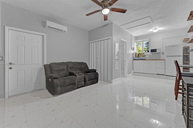 10371 SW 146th St, Miami, FL 33176 - living area featuring a wall unit AC, light marble finish floors, a ceiling fan, and a textured ceiling