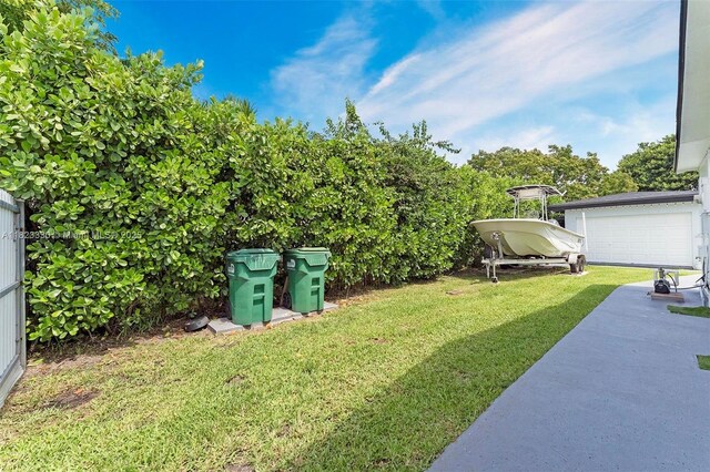 10371 SW 146th St, Miami, FL 33176 - view of green lawn featuring a detached garage