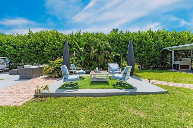 10371 SW 146th St, Miami, FL 33176 - view of grassy yard with an outdoor living space and a patio