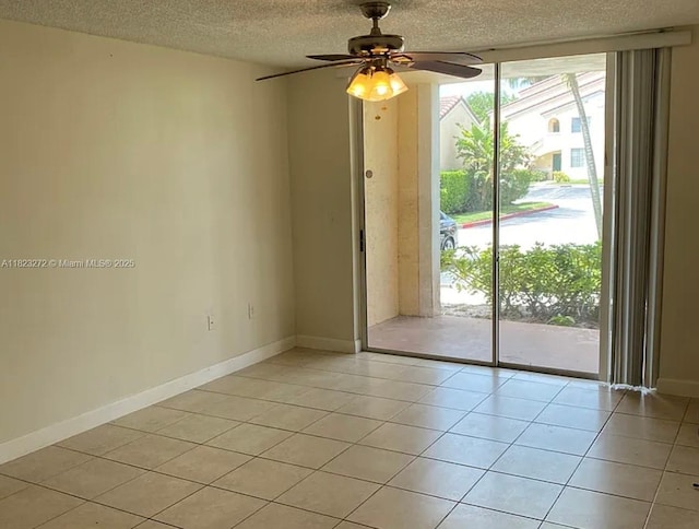 1733 Village Blvd Unit 105, West Palm Beach, FL 33409 - spare room with a textured ceiling, ceiling fan, and light tile patterned flooring