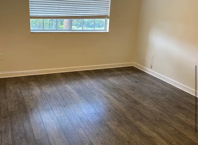 1733 Village Blvd Unit 105, West Palm Beach, FL 33409 - spare room with dark wood-style flooring and plenty of natural light