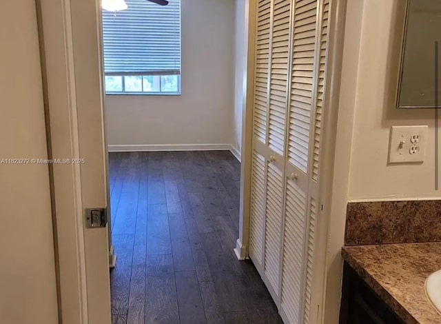 1733 Village Blvd Unit 105, West Palm Beach, FL 33409 - unfurnished bedroom with dark wood-style flooring and a closet