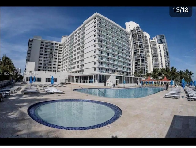 19201 Collins Ave, Sunny Isles Beach, FL 33160 - community pool with a patio area
