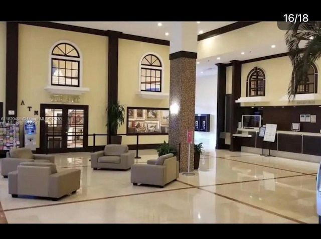 19201 Collins Ave, Sunny Isles Beach, FL 33160 - common area featuring a towering ceiling, crown molding, and recessed lighting