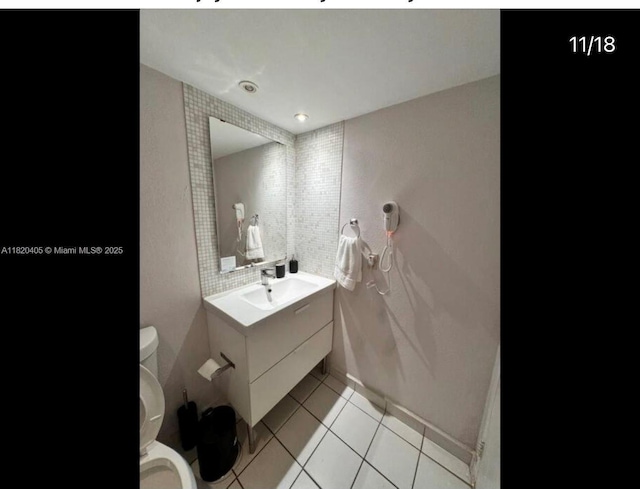 19201 Collins Ave, Sunny Isles Beach, FL 33160 - bathroom with vanity and tile patterned flooring
