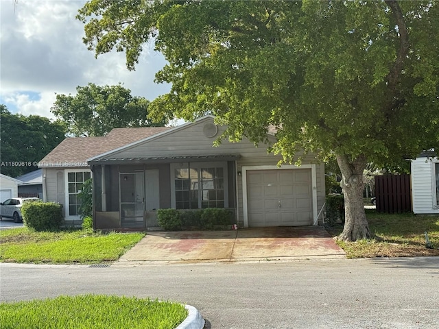 1792 SW 84th Ave, Miramar, FL 33025 - view of front of house with concrete driveway, a garage, and a sunroom