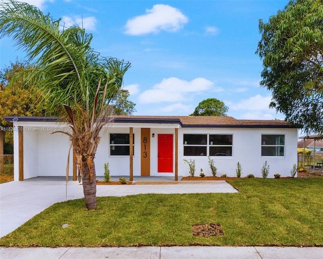 813SW 3rd Ct, Delray Beach, FL 33444 - ranch-style house with stucco siding, a front yard, an attached carport, and driveway