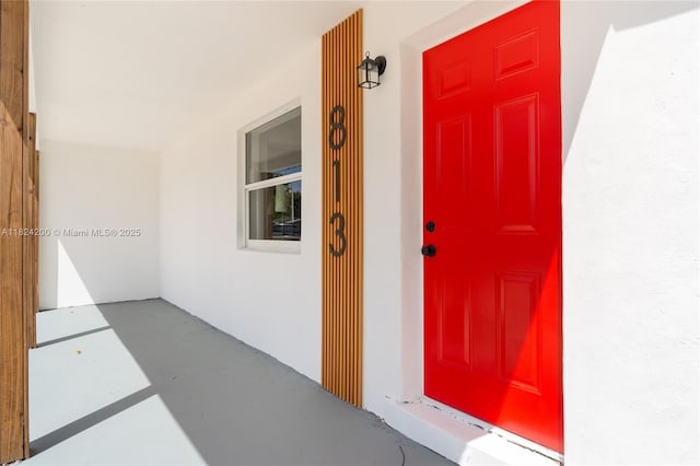 813SW 3rd Ct, Delray Beach, FL 33444 - doorway to property featuring stucco siding and covered porch