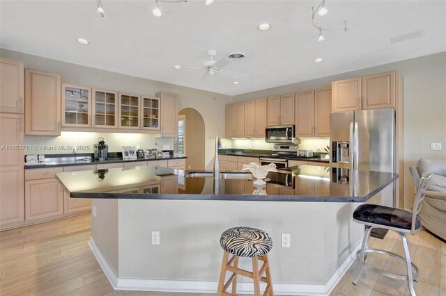 20406 SW 54th Pl, Pembroke Pines, FL 33332 - kitchen featuring light brown cabinetry, stainless steel appliances, dark countertops, and recessed lighting
