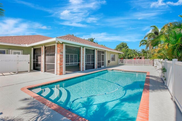 20406 SW 54th Pl, Pembroke Pines, FL 33332 - view of pool featuring a sunroom and a patio