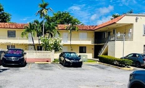 8701 SW 12th St Unit 30, Miami, FL 33174 - view of property with uncovered parking and stairs