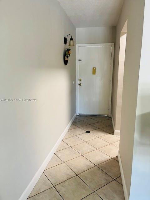 8701 SW 12th St Unit 30, Miami, FL 33174 - entryway with light tile patterned flooring