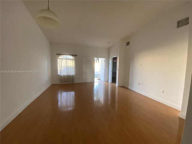 18942 NW 86th Ct, Hialeah, FL 33015 - empty room featuring wood finished floors and baseboards