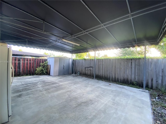18942 NW 86th Ct, Hialeah, FL 33015 - fenced backyard featuring a storage shed and a patio