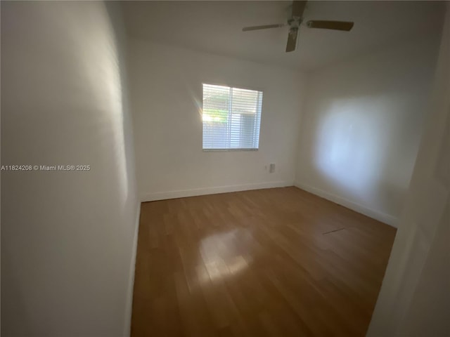 18942 NW 86th Ct, Hialeah, FL 33015 - unfurnished room with a ceiling fan and wood finished floors