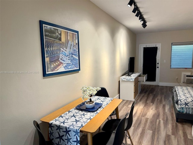 8132 Harding Ave Unit 2, Miami Beach, FL 33141 - dining area featuring track lighting, wood finished floors, and an AC wall unit