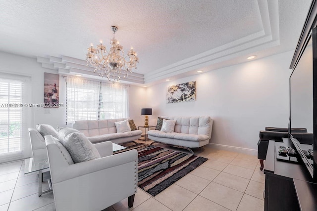 203 SE 8th St, Dania Beach, FL 33004 - living area featuring a raised ceiling, a chandelier, light tile patterned floors, and a textured ceiling