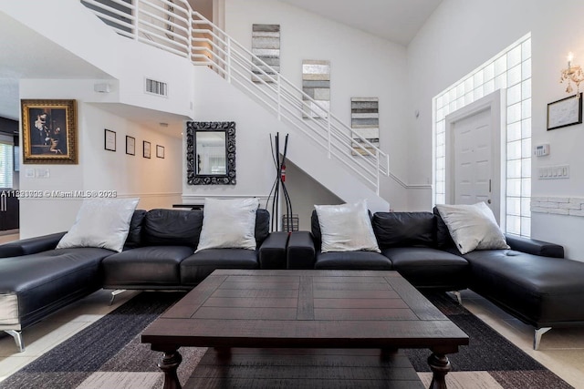 203 SE 8th St, Dania Beach, FL 33004 - tiled living area with high vaulted ceiling and stairway