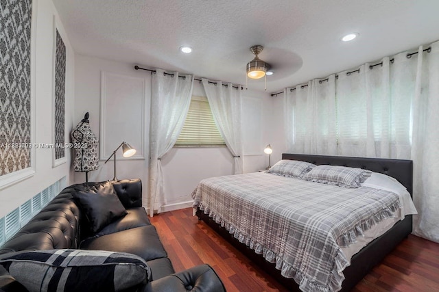 203 SE 8th St, Dania Beach, FL 33004 - bedroom with wood finished floors, recessed lighting, a ceiling fan, and a textured ceiling