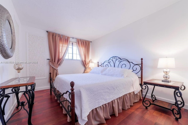 203 SE 8th St, Dania Beach, FL 33004 - bedroom with wood finished floors and baseboards