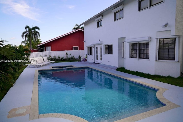 203 SE 8th St, Dania Beach, FL 33004 - view of swimming pool with french doors, a patio, and a pool with connected hot tub
