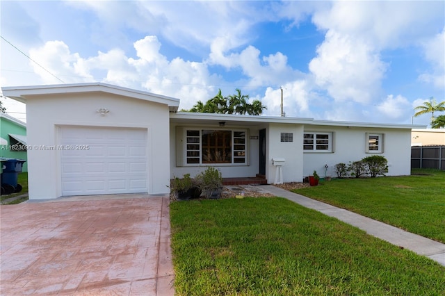 9351 SW 53rd St, Miami, FL 33165 - ranch-style house featuring decorative driveway, a garage, a front yard, and stucco siding