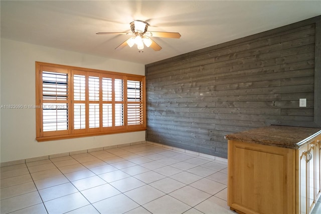 9351 SW 53rd St, Miami, FL 33165 - unfurnished dining area featuring a ceiling fan, light tile patterned floors, and wood walls