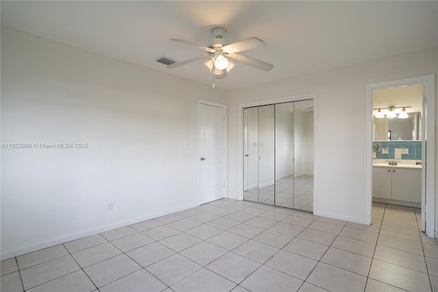 9351 SW 53rd St, Miami, FL 33165 - unfurnished bedroom featuring light tile patterned flooring, a closet, and ceiling fan