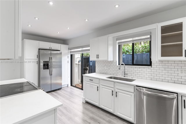 272 Fairway Cir Unit 98, Weston, FL 33326 - kitchen with stainless steel appliances, backsplash, light countertops, white cabinets, and recessed lighting