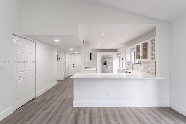 272 Fairway Cir Unit 98, Weston, FL 33326 - kitchen featuring stainless steel fridge with ice dispenser, light wood finished floors, glass insert cabinets, light countertops, and recessed lighting