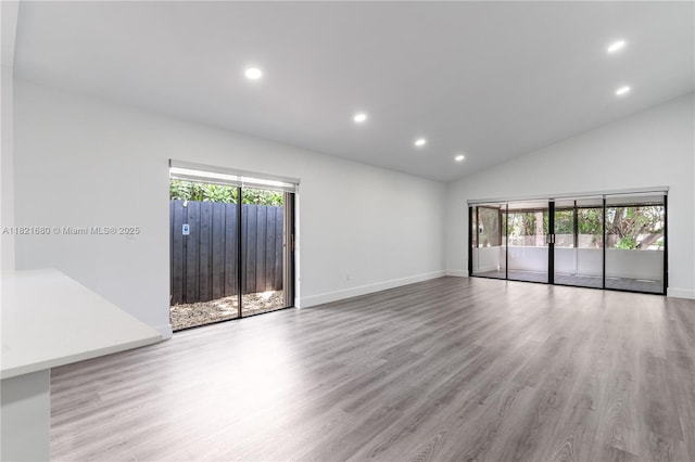 272 Fairway Cir Unit 98, Weston, FL 33326 - unfurnished room with recessed lighting, wood finished floors, and high vaulted ceiling